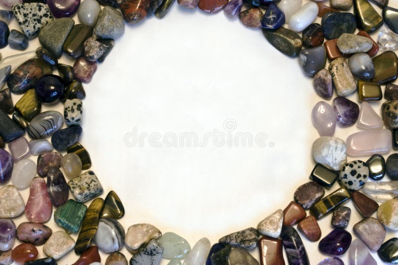 A circle formed by polished stones with a centre for lettering. A circle formed by polished stones with a centre for lettering