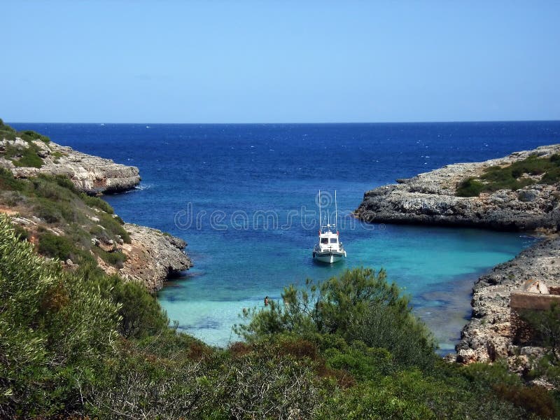 A boat navigating on the coast of Mallorca in Spain. A boat navigating on the coast of Mallorca in Spain