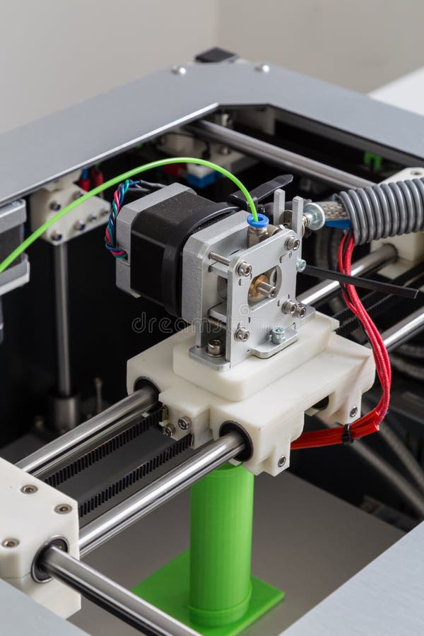 3d printer with bright green filament. stock image 3d printer with bright green filament. stock image