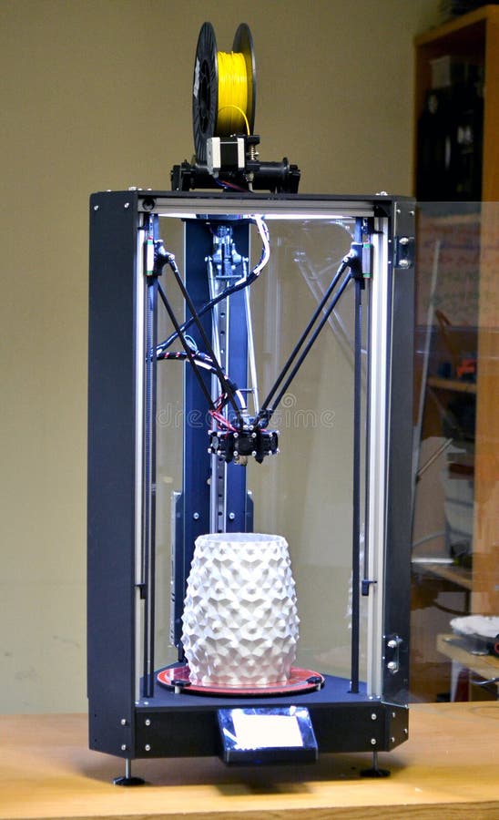 3d printer and object printed on it stock image