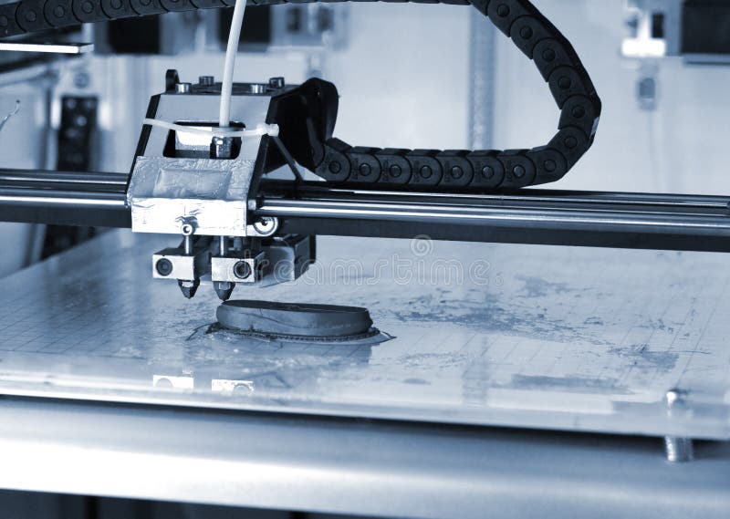 3D printer prints the form of molten plastic blue close-up stock image