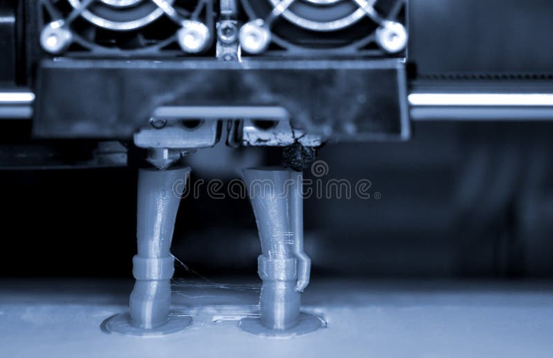 3D printer prints the form of molten plastic green. royalty free stock photography