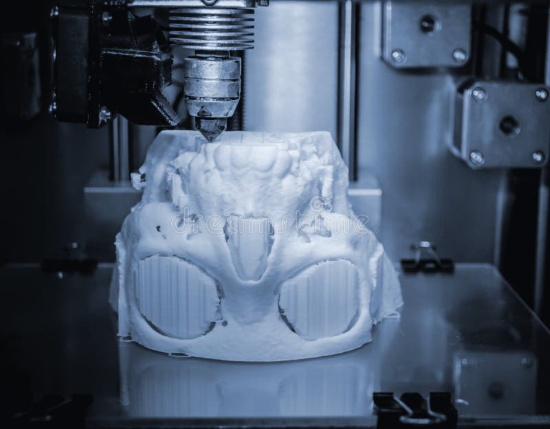 3D printer prints the form of molten plastic white. stock images