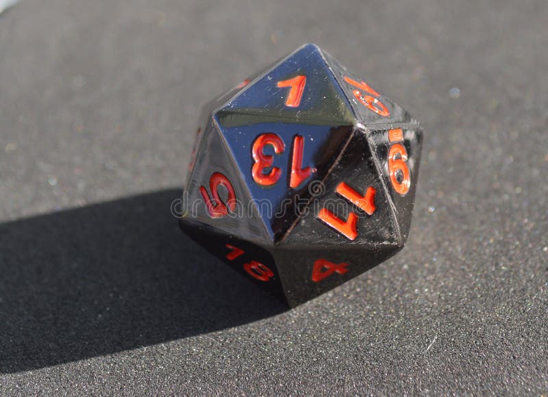 D20 Twentysided Black Metallic Die Dice on Foam Background in Bright