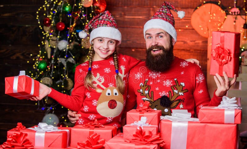 Dad and child opening christmas gifts. Happy holidays. Favorite childhood memories of christmas. Gifts for nearest