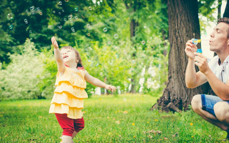 Dad and His Daughter are Making Bubbles Stock Photo - Image of ...