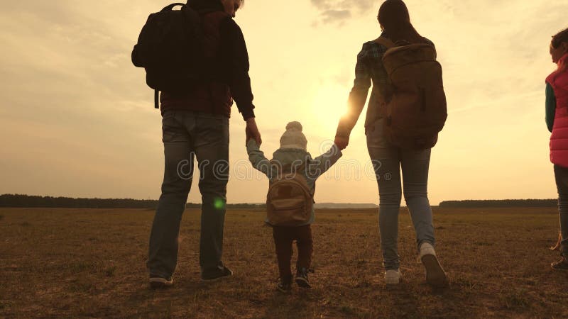 Dad, Mom, a small child and daughters and pets tourists. teamwork of a close-knit family. family travels with the dog on stock photos Dad, Mom, a small child and daughters and pets tourists. teamwork of a close-knit family. family travels with the dog on stock photos