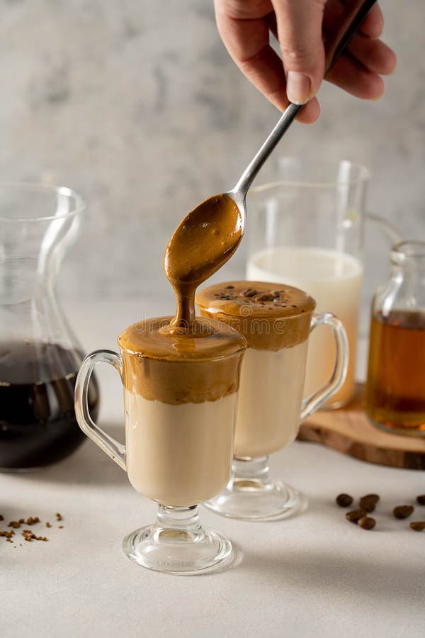 Dalgona Coffee. Iced Whipped Coffee and Milk. Refreshing Coffee Drink in Glass Cups. Stock Photo