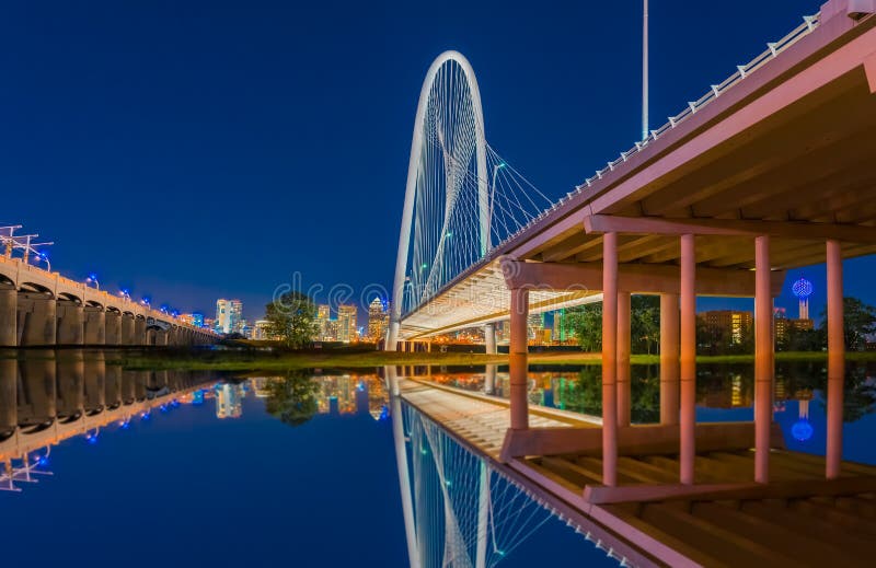 Dallas night lights reflect in water under bridge royalty free stock images