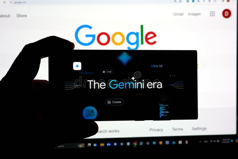 DALLAS, TX USA - FEBRUARY 19, 2024: A hand holding a cellphone with Google Gemini logo over google.com search page. Google Gemini 1.5 is a next generation large language model developed by Google AI. DALLAS, TX USA - FEBRUARY 19, 2024: A hand holding a cellphone with Google Gemini logo over google.com search page. Google Gemini 1.5 is a next generation large language model developed by Google AI