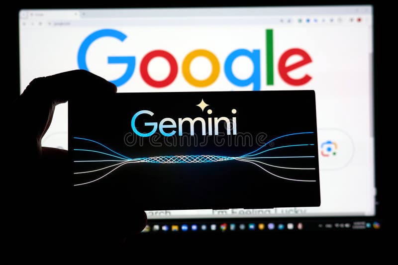 DALLAS, TX USA - FEBRUARY 19, 2024: A hand holding a cellphone with Google Gemini logo over google.com search page. Google Gemini 1.5 is a next generation large language model developed by Google AI. DALLAS, TX USA - FEBRUARY 19, 2024: A hand holding a cellphone with Google Gemini logo over google.com search page. Google Gemini 1.5 is a next generation large language model developed by Google AI