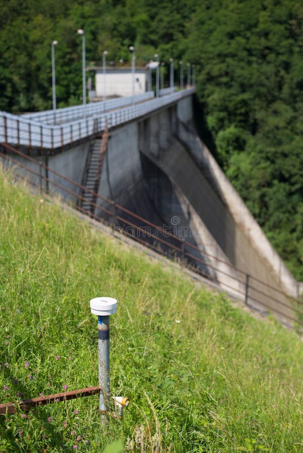 Instruments of measurement (strain gauge and topographic level) for stability monitoring on a dam. Instruments of measurement (strain gauge and topographic level) for stability monitoring on a dam.