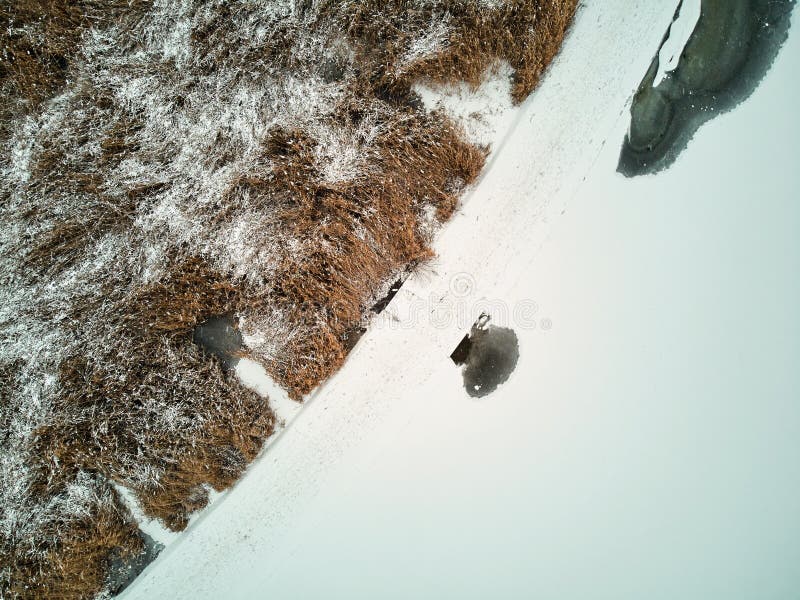 Dam in Valea Morilor park covered in snow. Aerial view from top. Chisinau, Moldova