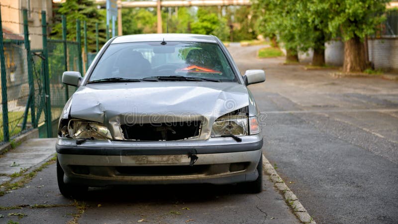 Damaged car after the accident stock photos