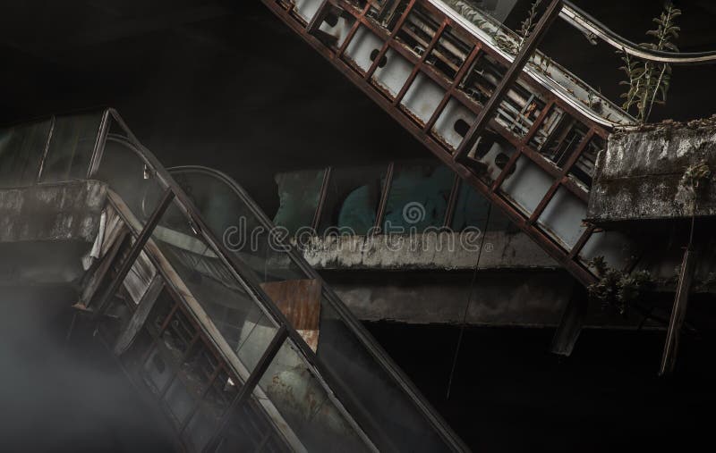 Damaged escalators in abandoned shopping mall building