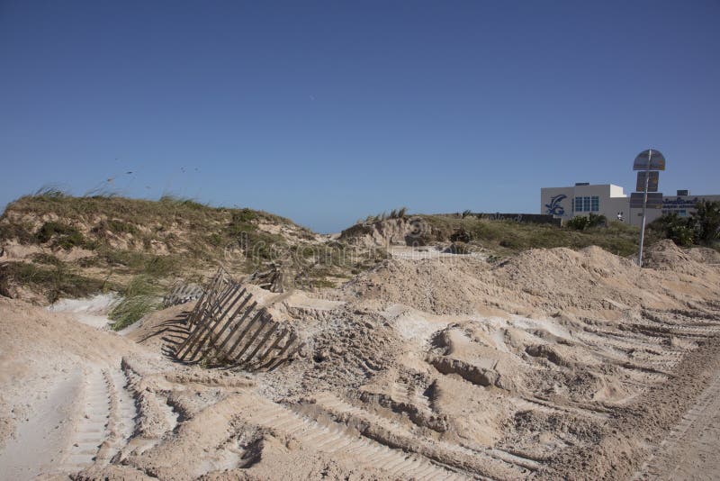 Damaged fence in sand dunes
