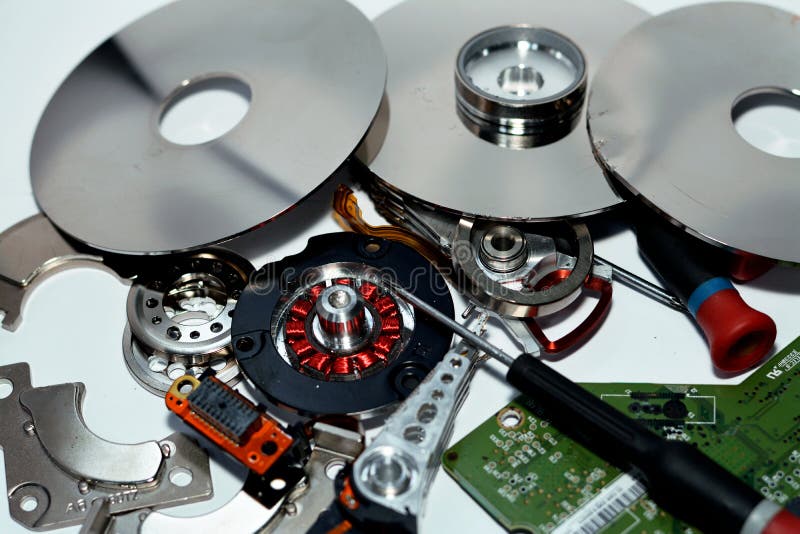 Damaged Hard disk drive components with disks, read write head, spindle motor, suspension, pivot, voice coil motor VCM, E-block royalty free stock images