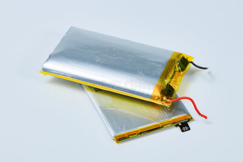 Damaged swollen Lithium polymer, Li-ion batteries for mobile device. royalty free stock image