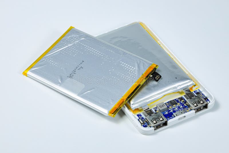 Damaged swollen Lithium polymer, Li-ion batteries for mobile device. stock photo