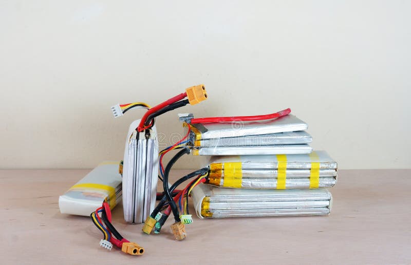 Damaged & unsafe swollen lithium polymer batteries royalty free stock image