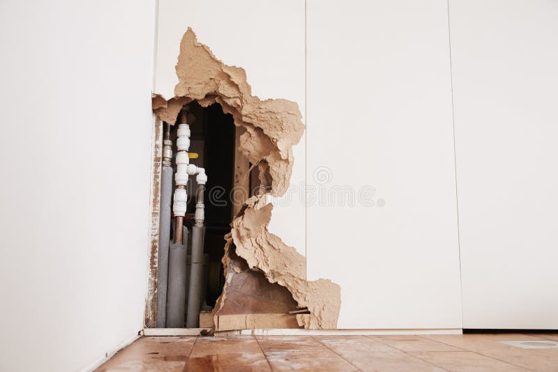 Damaged Wall Exposing Burst Water Pipes after Flood Stock Image Image