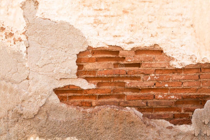 Damaged Wall with Red Brick Part Showing Closeup, Background/ Texture