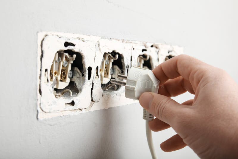 Damaged Wires in Electrical Outlet in Wall. Violation of Electrical