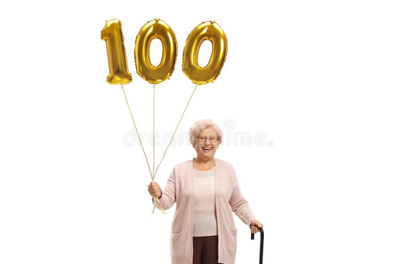 Dame âgée avec un ballon d'or du numéro cent et une canne de marche photographie stock