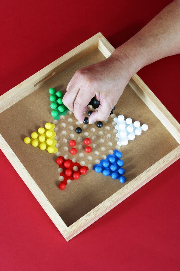 Jeu de dames chinoises avec une main photo stock