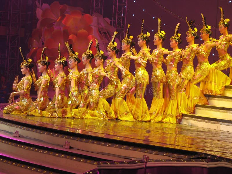 Dancing performance in Beijing, China. Awesome, thrilling, tear jerking . these are the words used by many to describe 'the gan-yin (Avalokite svara) with thousands of hands' performance in Beijing, China. It was an unusual dance performed by unusual people. With 21 young deaf-mute performers, the dance featured the 1, 000-hand gan-yin, goddess of mercy in Buddhism. It required all the dancers to perform in sync as one being in rhythm with the music. Without the ability to hear or speak, these dancers achieved the feat through signs. To help the dancers catch the rhythm of the music, sign language coaches were at the four corners of the stage. The signers and the dancers performed beautifully as the dance earned six rounds of applause. Choreographed by Zhang Jigang, one of China's most prominent dance choreographers, the dance is the fruit of many years of practice. Its first major international debut was in Athens on Sept. 28 at the closing ceremonies for the 2004 Paralympics. But it had long been in the repertoire of the China Disabled People's Performing Art Troupe and had traveled to more than 40 countries. The 21 dancers range from 28 to 14 in age. The 28-year-old leading dancer Tai Lihua is the soul of the dance. Dancing performance in Beijing, China. Awesome, thrilling, tear jerking . these are the words used by many to describe 'the gan-yin (Avalokite svara) with thousands of hands' performance in Beijing, China. It was an unusual dance performed by unusual people. With 21 young deaf-mute performers, the dance featured the 1, 000-hand gan-yin, goddess of mercy in Buddhism. It required all the dancers to perform in sync as one being in rhythm with the music. Without the ability to hear or speak, these dancers achieved the feat through signs. To help the dancers catch the rhythm of the music, sign language coaches were at the four corners of the stage. The signers and the dancers performed beautifully as the dance earned six rounds of applause. Choreographed by Zhang Jigang, one of China's most prominent dance choreographers, the dance is the fruit of many years of practice. Its first major international debut was in Athens on Sept. 28 at the closing ceremonies for the 2004 Paralympics. But it had long been in the repertoire of the China Disabled People's Performing Art Troupe and had traveled to more than 40 countries. The 21 dancers range from 28 to 14 in age. The 28-year-old leading dancer Tai Lihua is the soul of the dance.