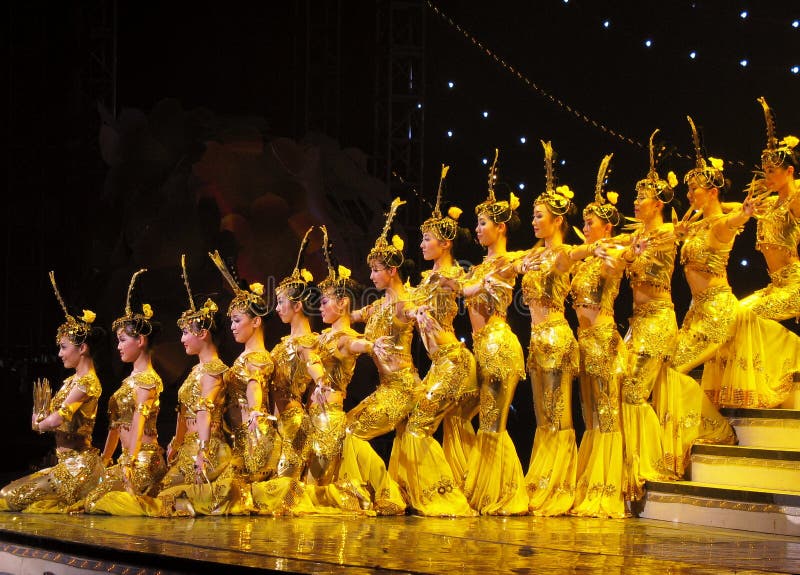 Dancing performance in Beijing, China. Awesome, thrilling, tear jerking ... these are the words used by many to describe 'the gan-yin (Avalokite svara) with thousands of hands' performance in Beijing, China. It was an unusual dance performed by unusual people. With 21 young deaf-mute performers, the dance featured the 1,000-hand gan-yin, goddess of mercy in Buddhism. It required all the dancers to perform in sync as one being in rhythm with the music. Without the ability to hear or speak, these dancers achieved the feat through signs. To help the dancers catch the rhythm of the music, sign language coaches were at the four corners of the stage. The signers and the dancers performed beautifully as the dance earned six rounds of applause. Choreographed by Zhang Jigang, one of China's most prominent dance choreographers, the dance is the fruit of many years of practice.Its first major international debut was in Athens on Sept. 28 at the closing ceremonies for the 2004 Paralympics. But it had long been in the repertoire of the China Disabled People's Performing Art Troupe and had traveled to more than 40 countries. The 21 dancers range from 28 to 14 in age. The 28-year-old leading dancer Tai Lihua is the soul of the dance. Dancing performance in Beijing, China. Awesome, thrilling, tear jerking ... these are the words used by many to describe 'the gan-yin (Avalokite svara) with thousands of hands' performance in Beijing, China. It was an unusual dance performed by unusual people. With 21 young deaf-mute performers, the dance featured the 1,000-hand gan-yin, goddess of mercy in Buddhism. It required all the dancers to perform in sync as one being in rhythm with the music. Without the ability to hear or speak, these dancers achieved the feat through signs. To help the dancers catch the rhythm of the music, sign language coaches were at the four corners of the stage. The signers and the dancers performed beautifully as the dance earned six rounds of applause. Choreographed by Zhang Jigang, one of China's most prominent dance choreographers, the dance is the fruit of many years of practice.Its first major international debut was in Athens on Sept. 28 at the closing ceremonies for the 2004 Paralympics. But it had long been in the repertoire of the China Disabled People's Performing Art Troupe and had traveled to more than 40 countries. The 21 dancers range from 28 to 14 in age. The 28-year-old leading dancer Tai Lihua is the soul of the dance.