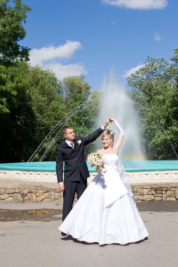 A dance of the newly married couple outdoors