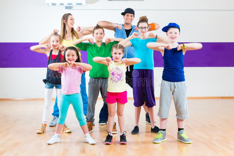 Dance teacher giving kids Zumba fitness class royalty free stock photos Dance teacher giving kids Zumba fitness class royalty free stock photos