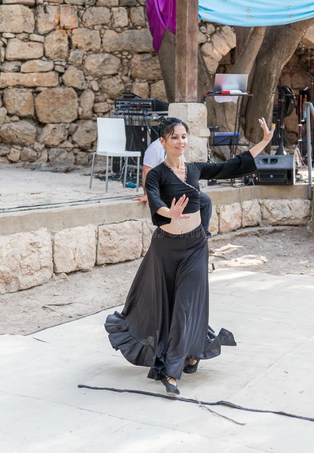 Jerusalem, Israel, September 29, 2018 : Dancer in a black authentic dress dances to the music for visitors at the annual festival `Jerusalem Knights`