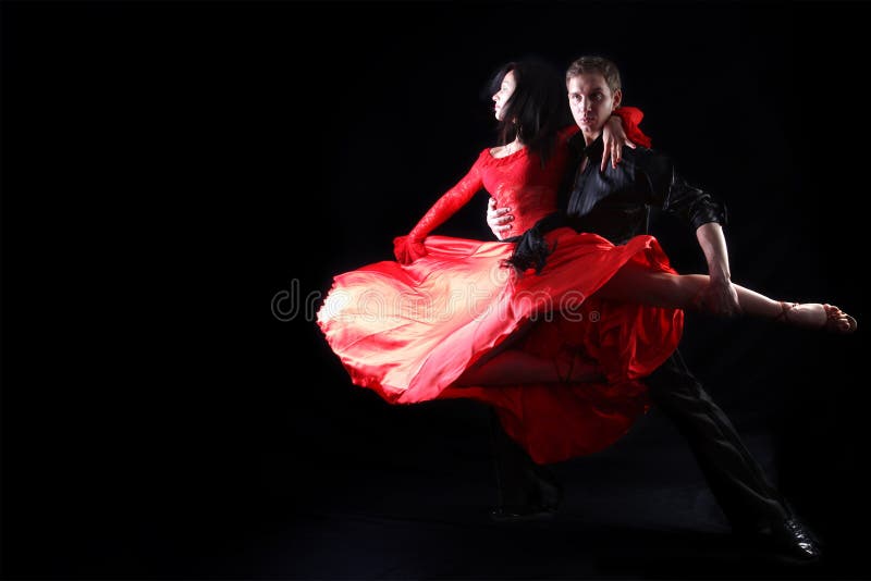 Dancers against black background