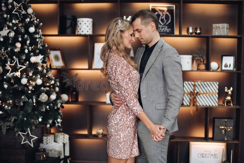 Dancing couple at Christmas under confetti.New Year stock photos Dancing couple at Christmas under confetti.New Year stock photos
