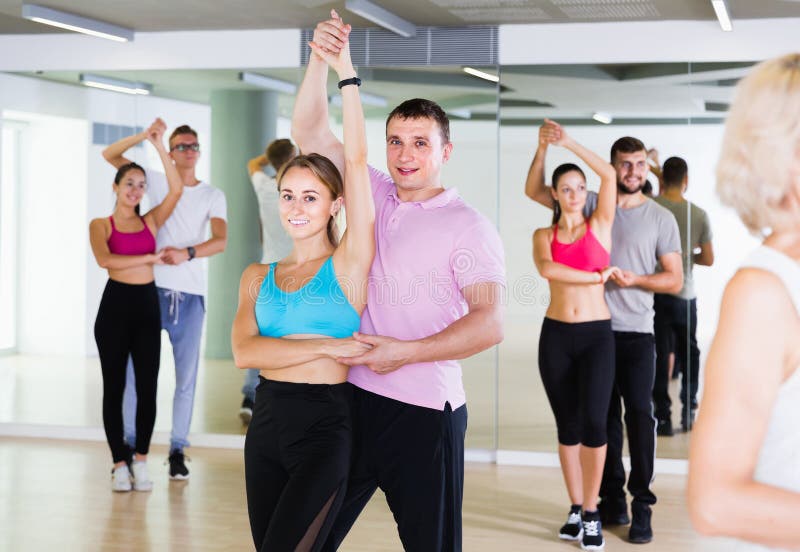 Dancing Couples Learning Salsa at Dance Class Stock Image - Image of ...