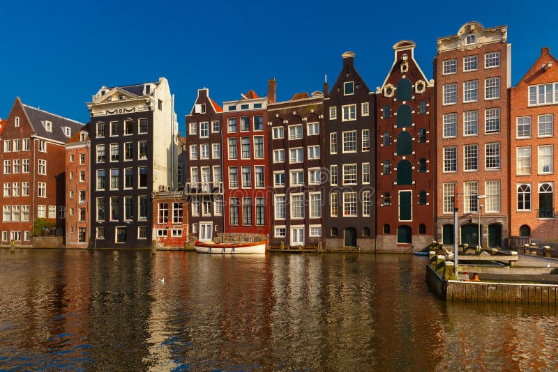 The Dancing Houses at Amsterdam Canal Damrak, Holland, Netherlands ...