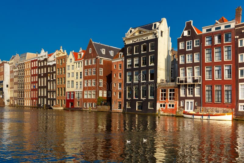 The Dancing Houses at Amsterdam Canal Damrak, Holland, Netherlands ...