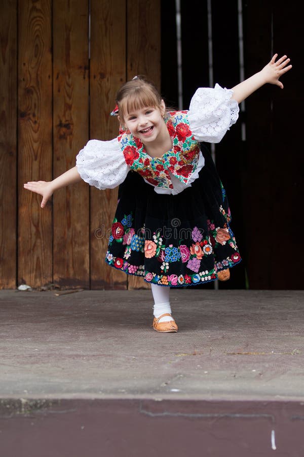 Dancing little girl acting on the stage