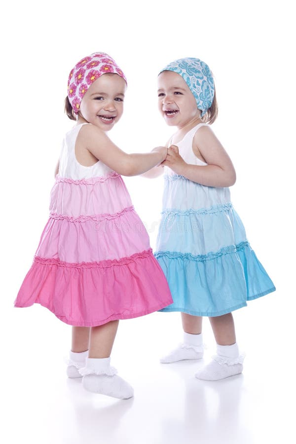 Dancing twins on white