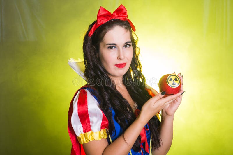 Danger, nuclear and radiation measurement - Girl holds apple with radiation hazard symbol. Nuclear and radiation measurement - Girl holds apple with radiation stock photography Danger, nuclear and radiation measurement - Girl holds apple with radiation hazard symbol. Nuclear and radiation measurement - Girl holds apple with radiation stock photography