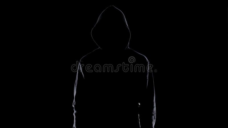 Dangerous anonymous male in night darkness, scary terrorist preparing for crime stock photo Dangerous anonymous male in night darkness, scary terrorist preparing for crime stock photo