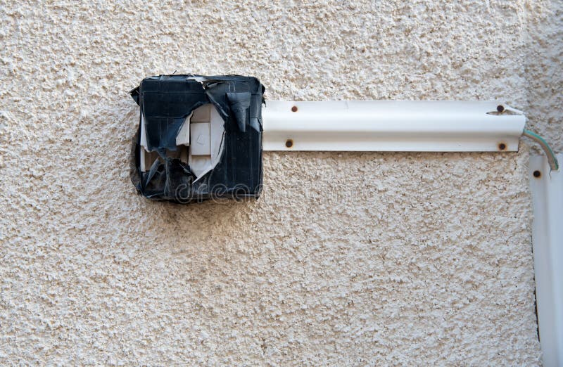 Dangerous door bell switch on the wall