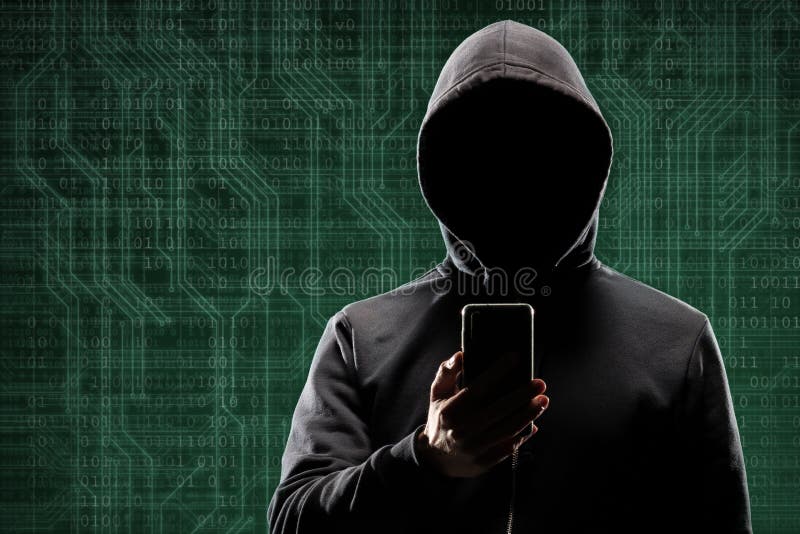 Dangerous hacker with a smartphone gadget over digital background with binary code. Obscured dark face in mask and hood stock image Dangerous hacker with a smartphone gadget over digital background with binary code. Obscured dark face in mask and hood stock image