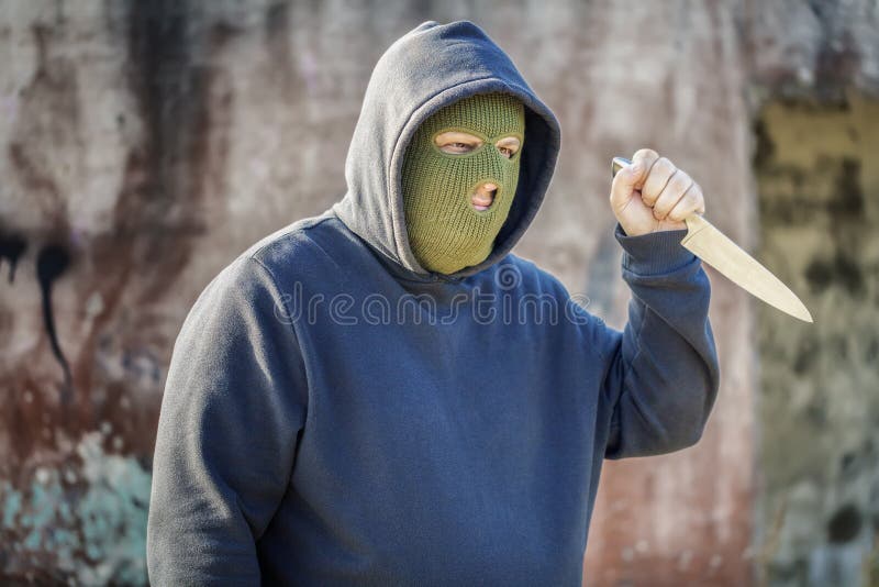 Dangerous Man with Kitchen Knife Near Building Wall Stock Photo Image