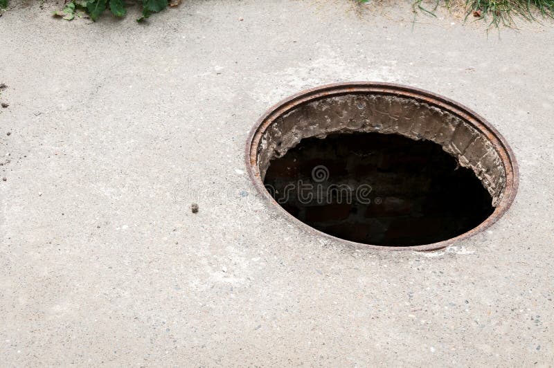 Dangerous opened manhole hole cover, danger for people who walking on the street in the city royalty free stock images Dangerous opened manhole hole cover, danger for people who walking on the street in the city royalty free stock images