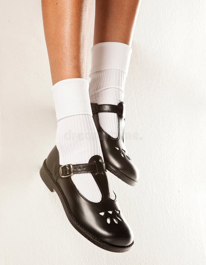 Dangling Girls School Shoes Stock Image - Image of cross, feet: 38984295