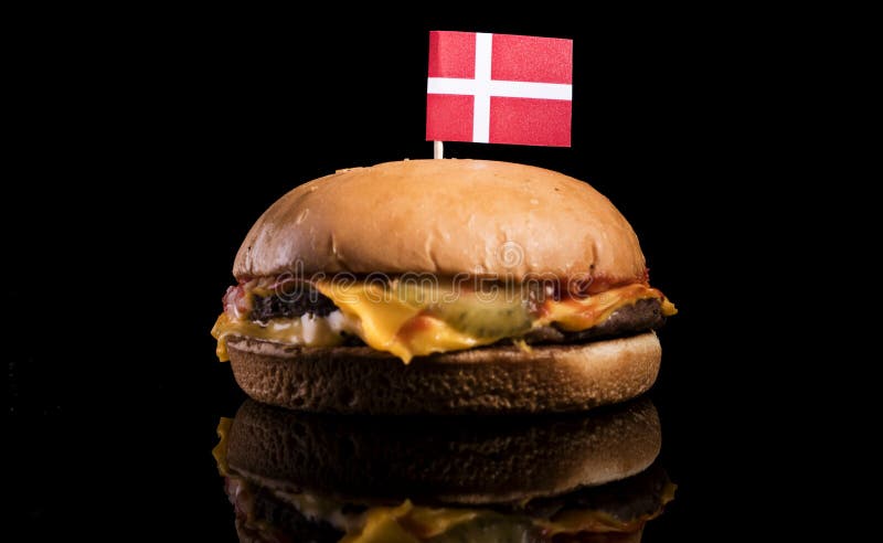 Danish flag on top of hamburger isolated on black royalty free stock image Danish flag on top of hamburger isolated on black royalty free stock image
