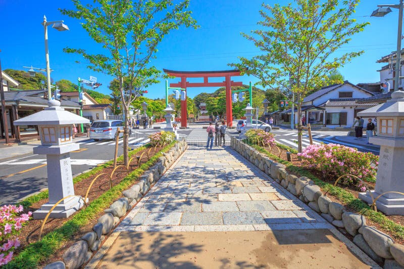 Kamakura, Japan - April 23, 2017: After Torii gate in Dankazura pathway with cherry trees to Tsurugaoka Hachiman shinto sanctuary in Kamakura, Japan. Kamakura, Japan - April 23, 2017: After Torii gate in Dankazura pathway with cherry trees to Tsurugaoka Hachiman shinto sanctuary in Kamakura, Japan.